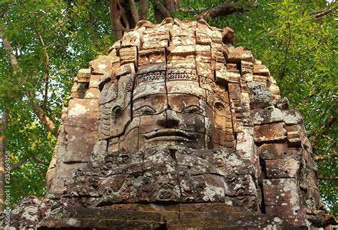 Face Tower With Ancient Carved Smiling Buddhist Face Of Lokeshvara