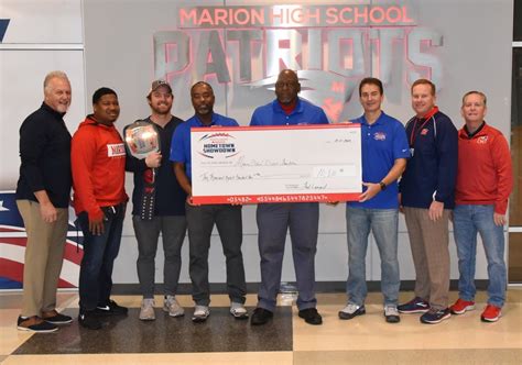 Hometown Showdown Organizers Present Check To District Marion High