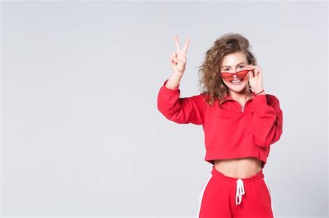 Premium Photo Pretty Girl Posing In Red Wear Nice Body Nude Make Up With Red Sunglasses