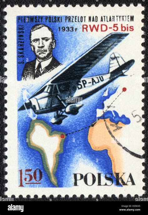 A Postage Stamp Printed In Poland Shows Airplane Sp Aju And Pilot Of S