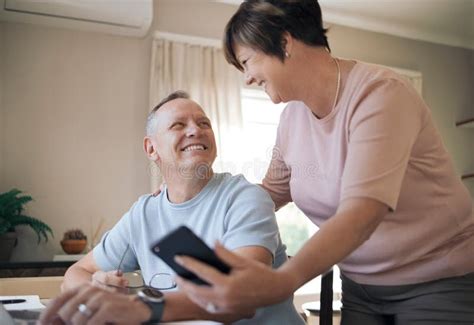 I Have Something I Want To Show You A Mature Husband And Wife Together Using A Smartphone