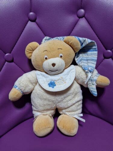 Peluche Doudou Ours Ajena Marron Beige Bonnet Bavoir Blanc Fleur Cm