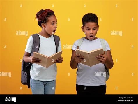 Excited african american boy and girl going to school Stock Photo - Alamy