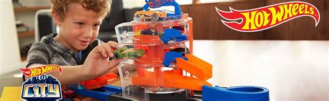 Hot Wheels City Concesionario Giratorio Pistas de Coches de Juguetes niños 3 años Mattel