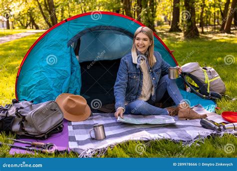 Blonde Cute Female Traveler Sitting Near The Tent In The Forest Stock Photo Image Of Caucasian