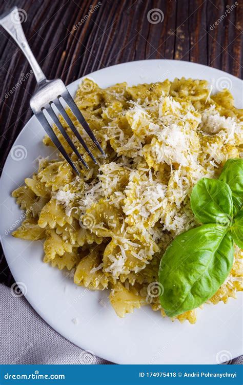 Delicious Farfalle Pasta With Pesto Sauce On Wooden Rustic Background