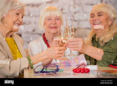 Three Mature Women Having A Celebration And Drinking Champaigne Stock Photo Alamy