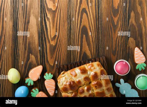 Easter Hot Cross Buns With Colored Eggs Easter Gingerbread Rabbits And Cookies Over Dark Brown