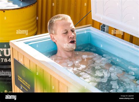 Boy Or Man Breathing Deeply And Bathing In The Cold Water Among Ice