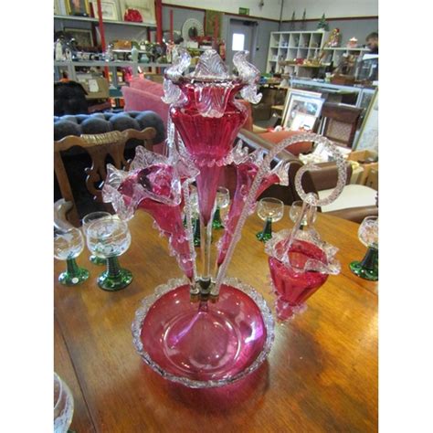 A Victorian Cranberry Glass Epergne Centrepiece Three Epergnes And Two Hanging Baskets 48cm Tall