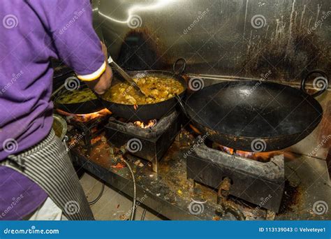 Man Cooking in a Real Grungy Dirty Restaurant Industrial & Commercial ...