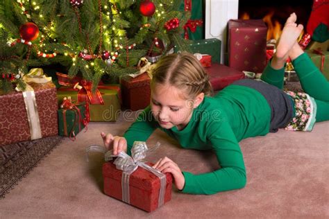 Opening Christmas Gifts Royalty Free Stock Photos - Image: 27795298