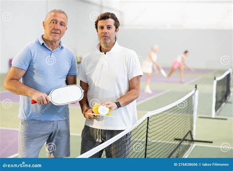 Two Male Pickleball Players Standing On Indoor Court Stock Photo