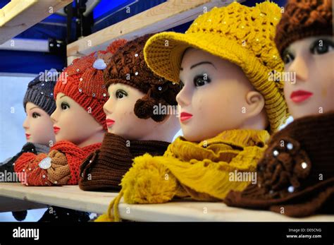 Head Mannequins Displaying Hats And Scarves On A Market Stall Stock