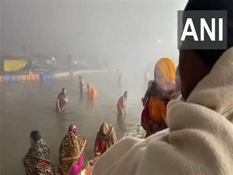 Prayagraj Devotees Take Holy Dip At Triveni Sangam During Magh Mela