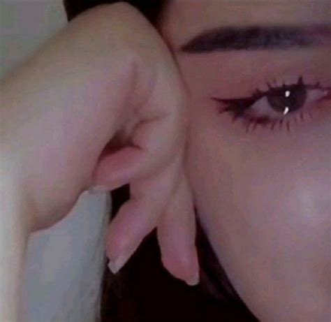 A Close Up Of A Woman S Eye With Long Eyelashes