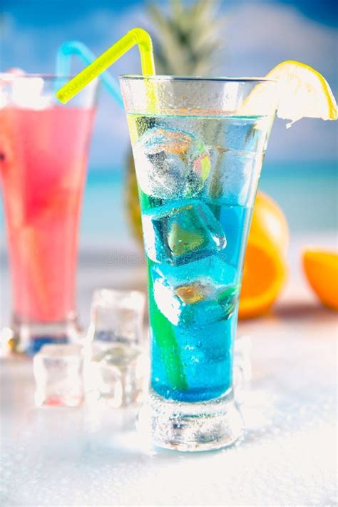 Set of Exotic Drinks on the Beach with Blue Ocean Background Stock ...