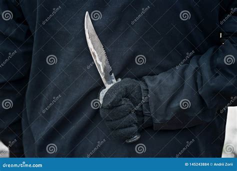 Man with the Knife. Hand with a Knife Behind His Back Stock Photo ...