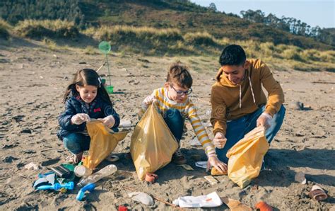 Young Volunteers Cleaning the Beach Stock Photo - Image of collaborate ...