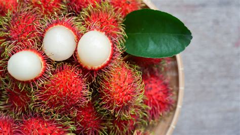 Red Spiky Fruit With Orange Center