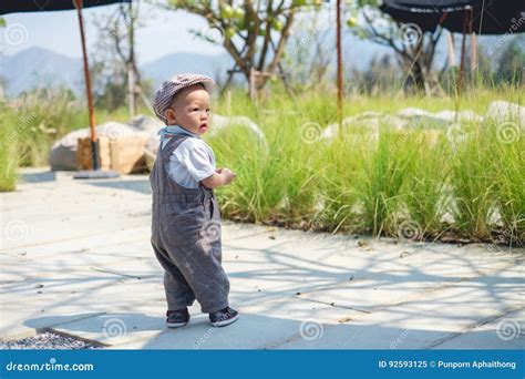 Toddler Baby Boy Walking Baby`s First Steps Concept Stock Image