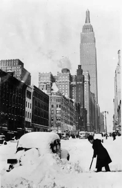 SNOW IN NEW York after a surprising snowstorm a driver is clearing- Old ...