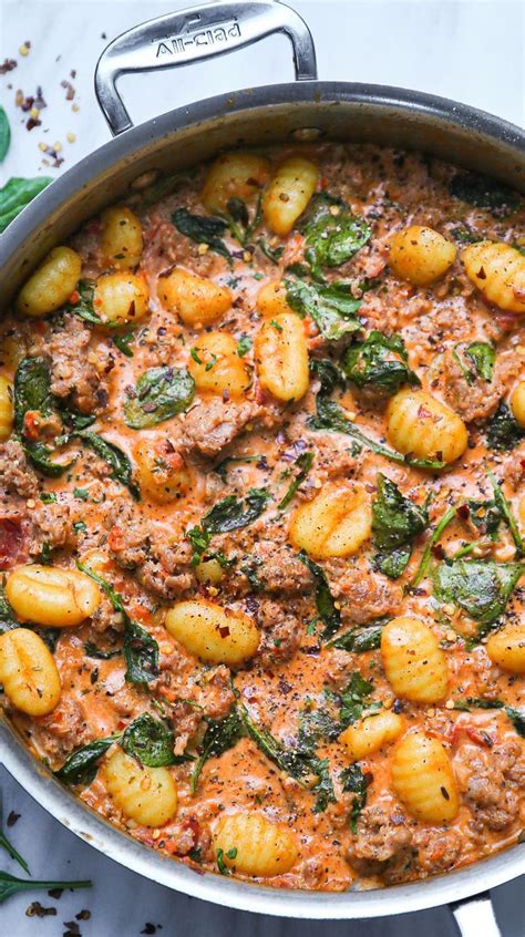 Creamy Sausage Gnocchi With Spinach And Tomato Sauce In A Stainless