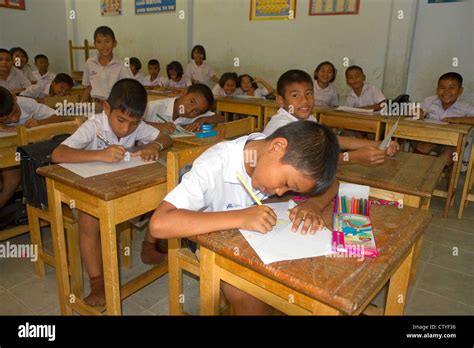 Thai elementary school students sit a desks on the island of Ko Samui, Thailand Stock Photo - Alamy