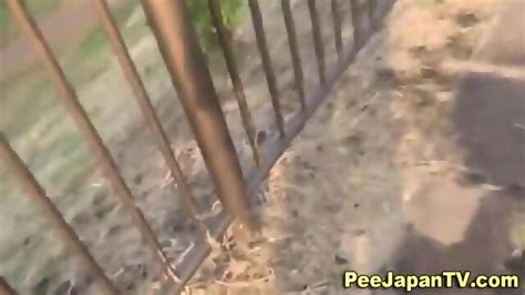 Asian Babe Caught Peeing