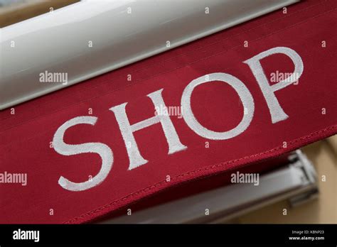 Red And White Shop Sign On Diagonal Slant Stock Photo Alamy