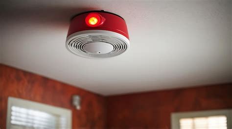 Red Warning Light And Active Smoke Detector In The Room Ceiling Premium Ai Generated Image