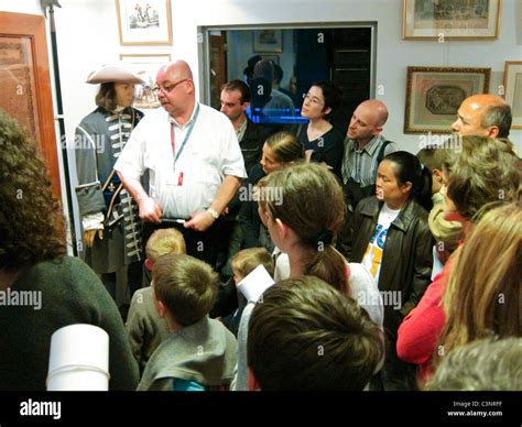 Paris France Male Tour Guide Leading Groups Talking To Crowd Of