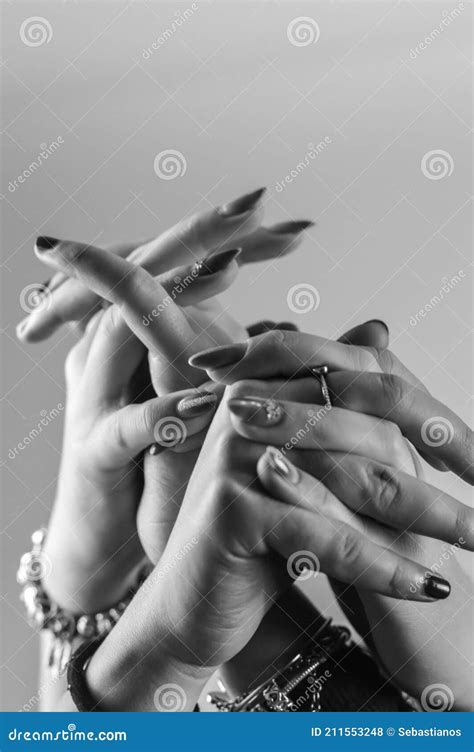 Black And White Female Hands With Intertwined Fingers Show A Great