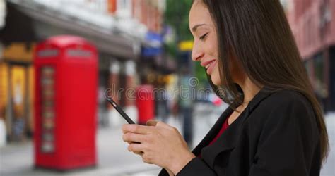 Side View Of Happy Latina Female Texting On Cellphone On London Street Stock Video Video Of