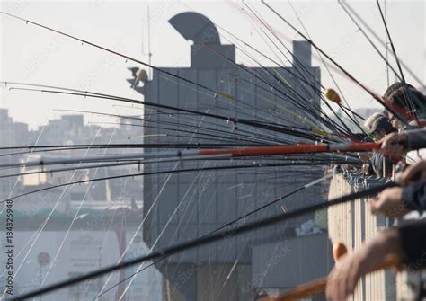 Fishermen and fishing lines on Galata Bridge in İstanbul Stock Photo ...