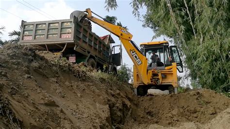 Jcb Backhoe Machine Cutting Soil And Loading In Dump Truck Jcb Making