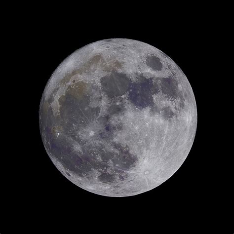 lunar craters visible on the moon on the night sky at popovec, colors ...