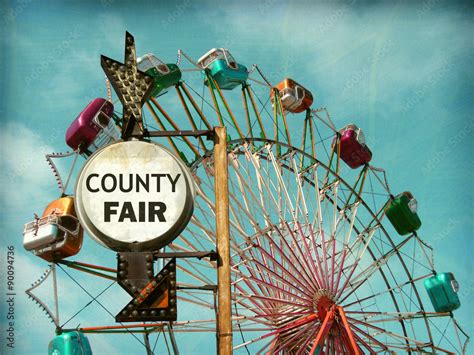 aged and worn vintage photo of county fair sign with ferris wheel Stock ...