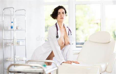 Portrait Of Luxurious Naked Nurse In A White Coat In The Interior Of Clinic Stock Image Image