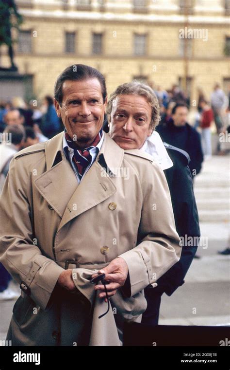 English actors Roger Moore and Michael Caine Stock Photo - Alamy