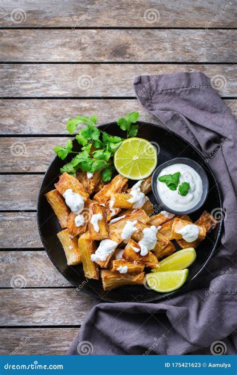 Fried Yucca Yuca Cassava Manioca Mandioca With Cilantro Sauce Stock