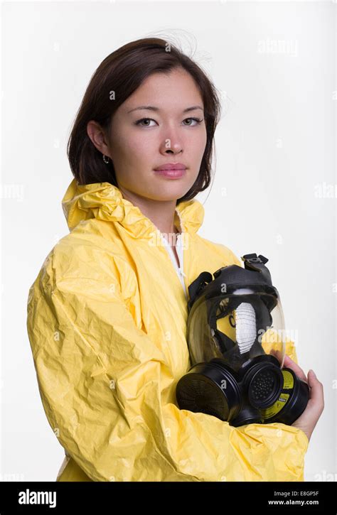 Woman With Hazmat Hazardous Materials Suit And Gas Mask Stock Photo