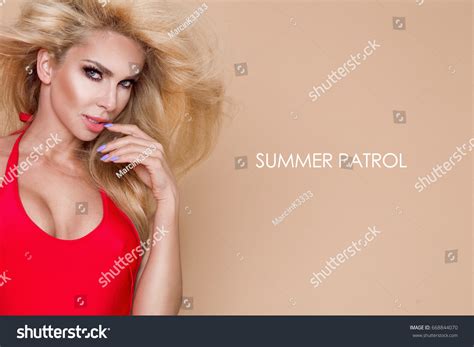 Sexy Busty Blonde Lifeguard Woman Red Stock Photo 668844070 Shutterstock