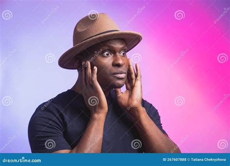 Portrait Of Excited Young African American Male Screaming In Shock And