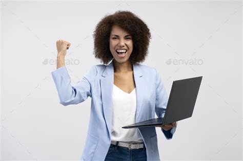 Overjoyed African American Woman Holding Laptop Computer Celebration