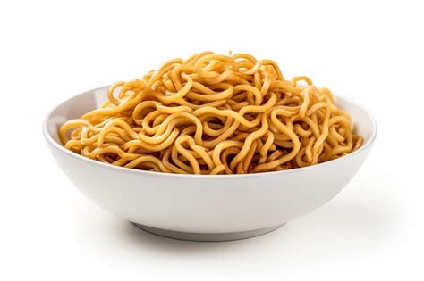 Premium Photo A White Bowl Filled With Noodles On Top Of A Table