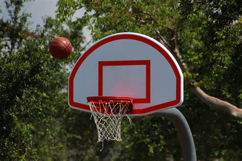 Photo Of Ball Near Basketball Hoop · Free Stock Photo