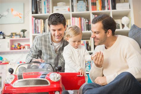 Male Gay Parents And Baby Son Playing With Toy Car Stock Image F018 5598 Science Photo Library