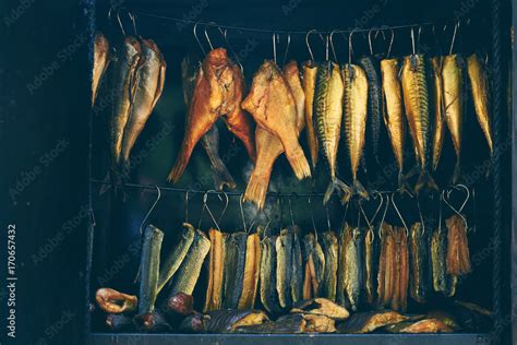 Fish Smoking Process Marine Fish In Smokehouse Stock Photo Adobe Stock