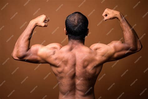 Premium Photo Rear View Of Muscular Indian Man With Mustache Shirtless